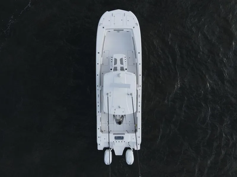 Slide: The Image of 2026 Caymas 34 CT boat on trailer in parking lot, sunny day. - 5