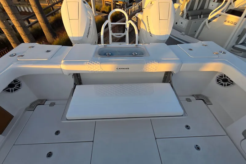Slide: The Image of 2026 Caymas 34 CT boat deck with seating and storage compartments. - 8