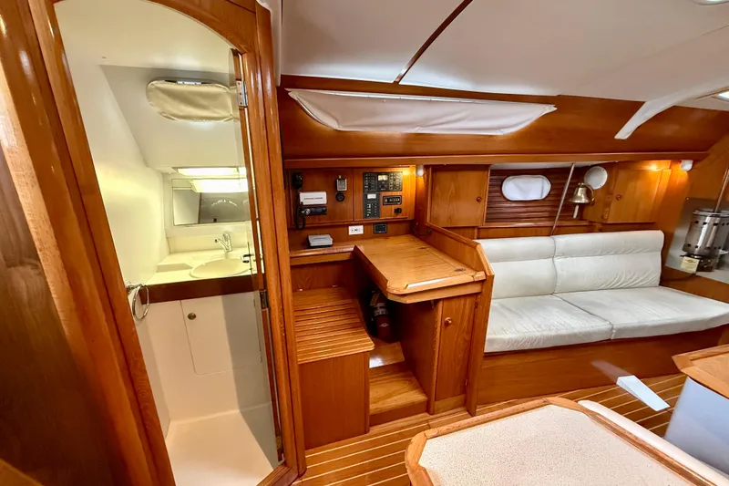 Slide: The Image of Interior of 1997 Jeanneau Sun Odyssey 36.2 yacht with kitchen and dining area. - 12