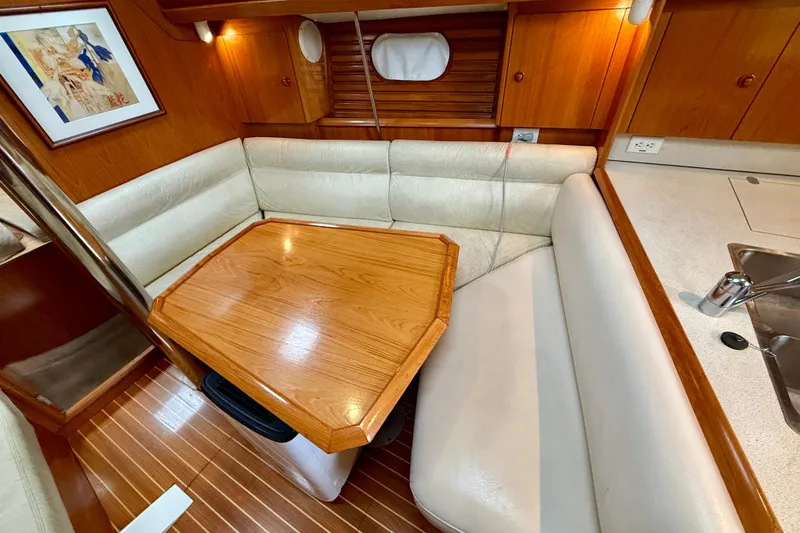 Slide: The Image of Cozy cabin interior of 1997 Jeanneau Sun Odyssey 36.2 sailboat with wooden cabinetry. - 16
