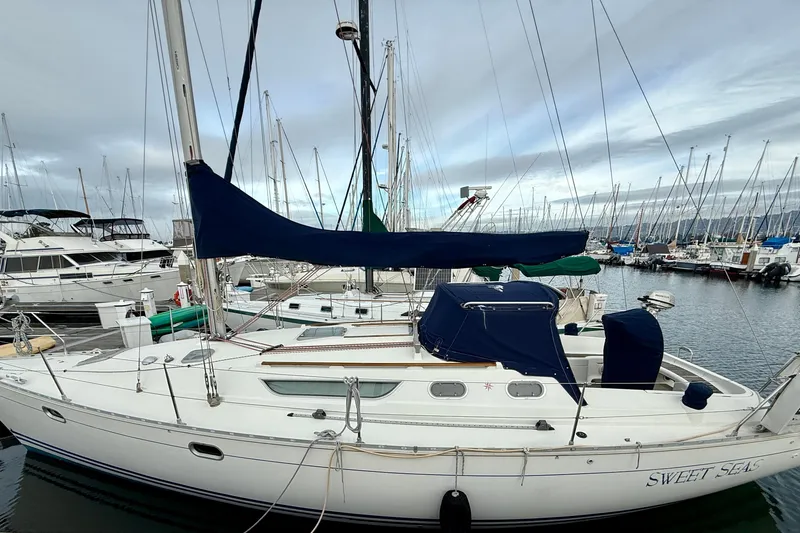 Slide: The Image of Jeanneau Sun Odyssey 36.2 sailboat docked at marina, 1997 model. - 2
