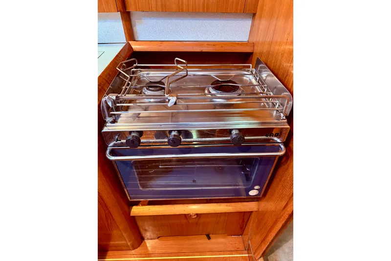 Slide: The Image of Engine of a 1997 Jeanneau Sun Odyssey 36.2 sailboat, showcasing belts and hoses. - 27