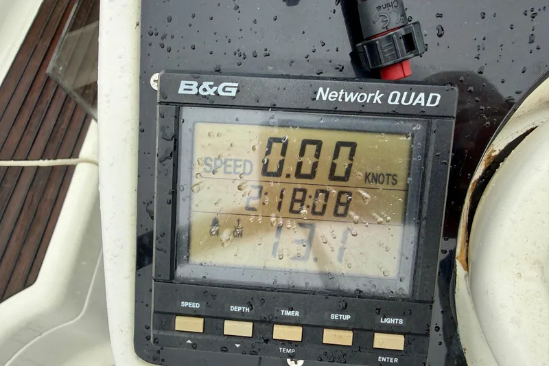 Slide: The Image of Rain-soaked navigation instruments on a 1997 Jeanneau Sun Odyssey 36.2 sailboat. - 46