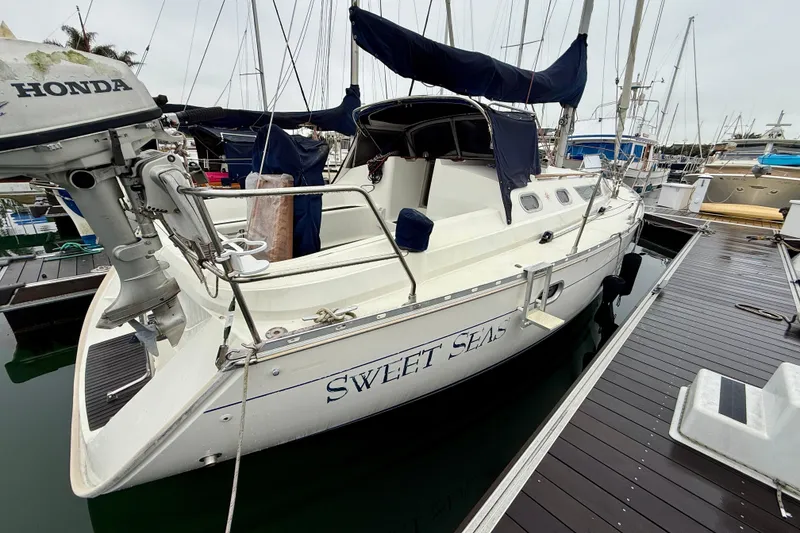 Slide: The Image of Deck view of 1997 Jeanneau Sun Odyssey 36.2 sailboat docked at marina. - 5