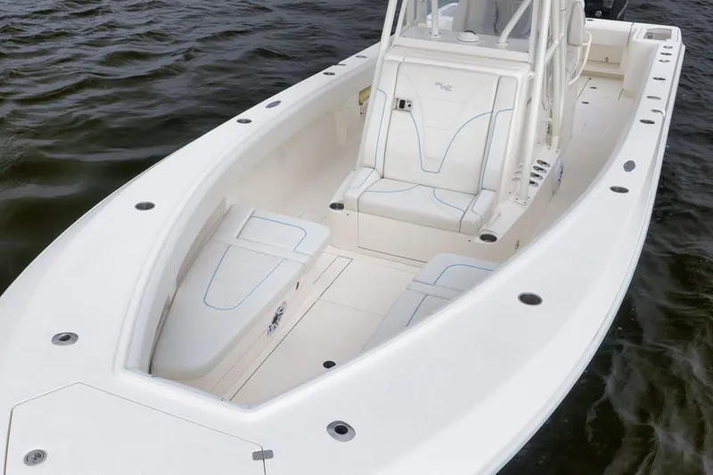 Slide: The Image of 2023 SeaVee 322Z boat interior with cushioned seating and spacious deck design. - 10
