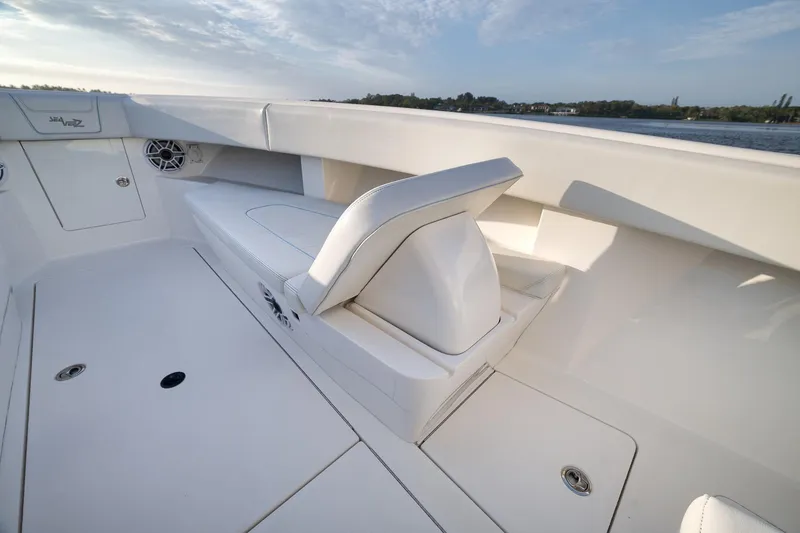 Slide: The Image of 2023 SeaVee 322Z boat interior with cushioned seating and storage compartments. - 18