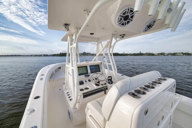 Slide: The Image of 2023 SeaVee 322Z boat interior with advanced navigation system on calm waters. - 31
