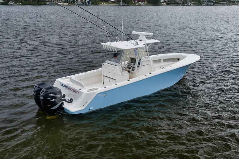 Slide: The Image of 2023 SeaVee 322Z boat on water, featuring dual Mercury engines. - 4