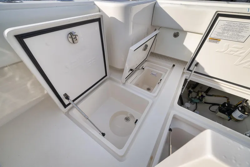 Slide: The Image of 2023 SeaVee 322Z boat storage compartments and utility access. - 48