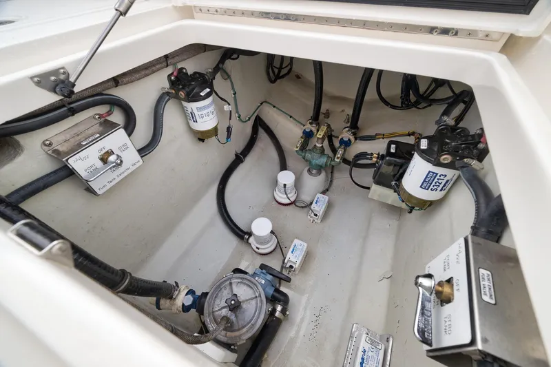 Slide: The Image of 2023 SeaVee 322Z boat engine compartment with fuel system components and wiring. - 49