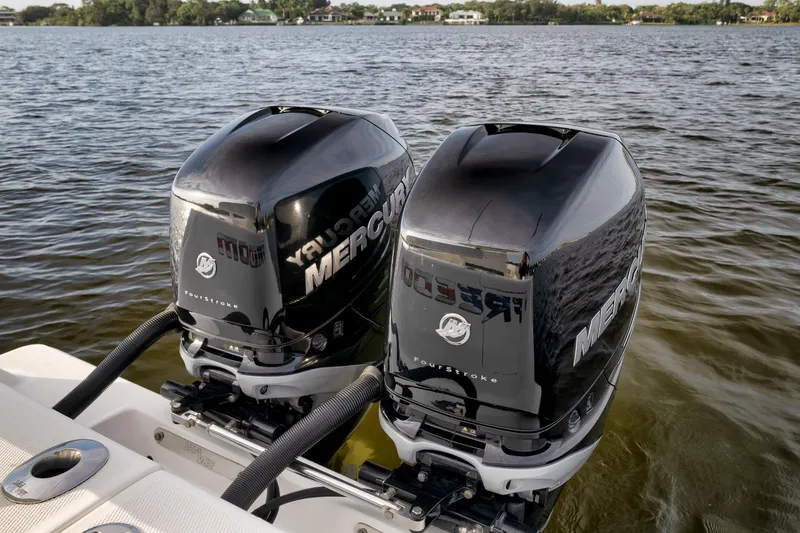 Slide: The Image of Twin Mercury outboard engines on 2023 SeaVee 322Z boat, cruising on a serene lake. - 50