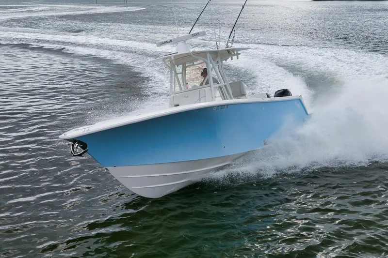 Slide: The Image of 2023 SeaVee 322Z boat cruising swiftly on open water, creating a dynamic wake. - 51
