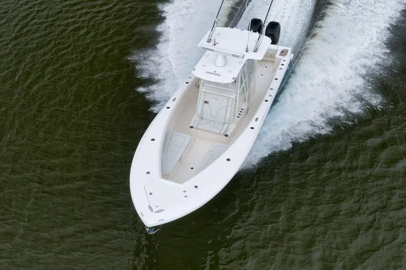 Slide: The Image of 2023 SeaVee 322Z boat cruising on water, aerial view. - 59