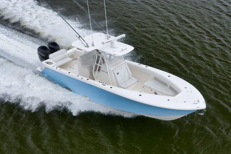 Slide: The Image of 2023 SeaVee 322Z boat cruising on water, featuring dual engines and sleek design. - 60