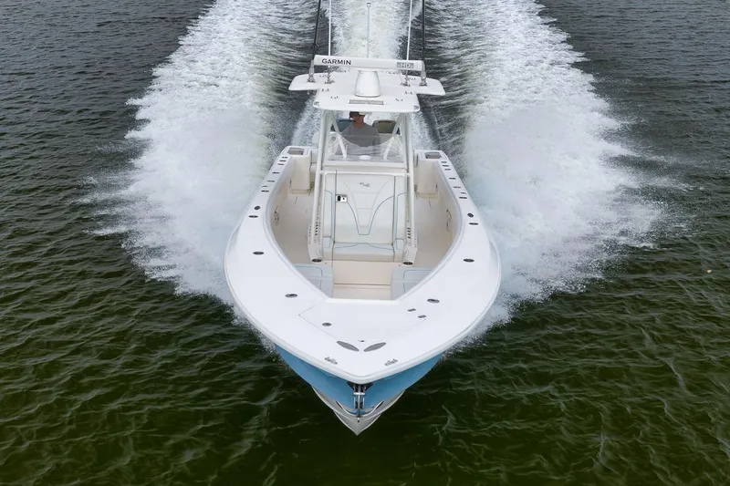 Slide: The Image of 2023 SeaVee 322Z boat cruising on open water, aerial view. - 64