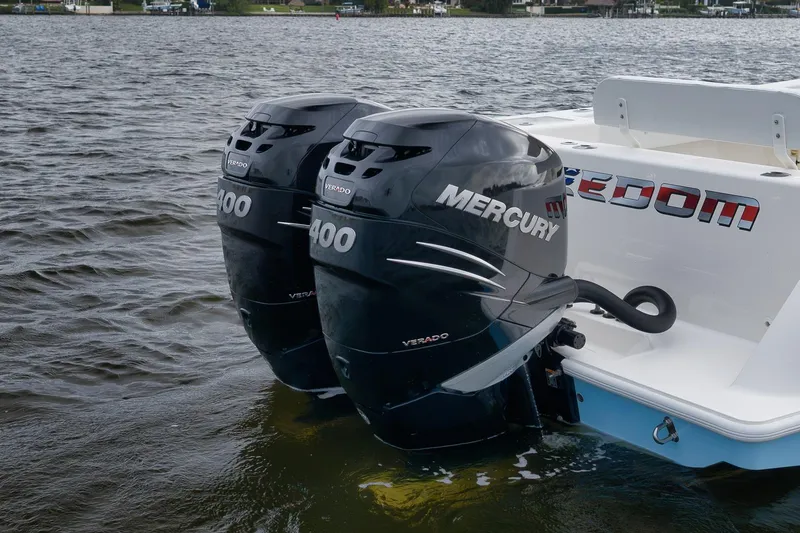 Slide: The Image of 2023 SeaVee 322Z boat with twin Mercury 400 Verado outboard engines on water. - 8