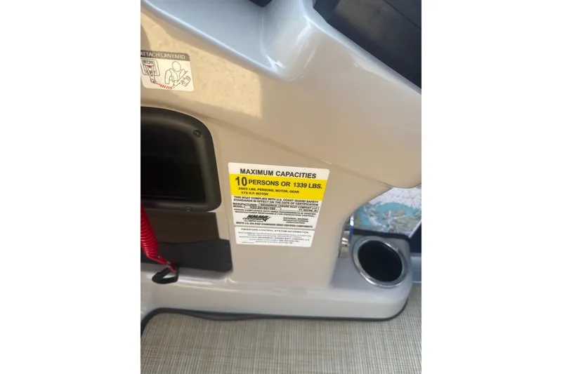 Slide: The Image of 2025 Harris Cruiser 230 capacity label, maximum 10 persons or 1339 lbs. - 12