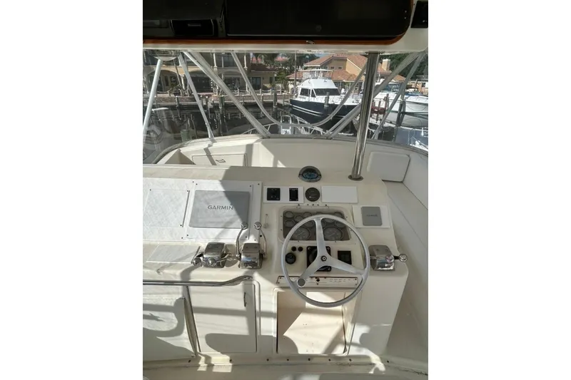 Slide: The Image of Cockpit of 1988 Ocean Yachts 48 Super Sport with steering wheel and navigation equipment. - 14