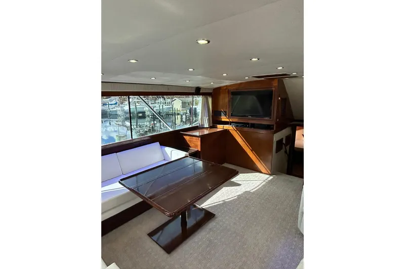 Slide: The Image of Luxurious interior of 1988 Ocean Yachts 48 Super Sport with elegant seating and large windows. - 6