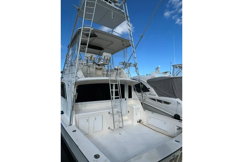 Slide: The Image of 1988 Ocean Yachts 48 Super Sport boat with tower and spacious deck. - 3