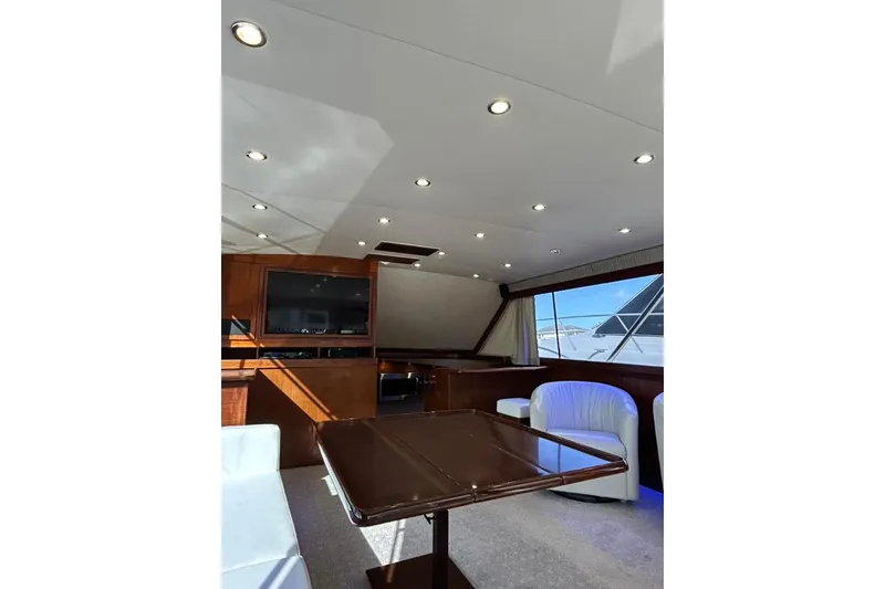 Slide: The Image of Interior of 1988 Ocean Yachts 48 Super Sport with modern seating and large windows. - 8
