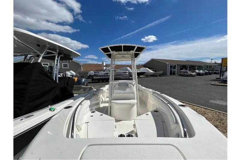 Slide: The Image of 2024 Key West 203 FS boat displayed outdoors under a clear blue sky. - 3