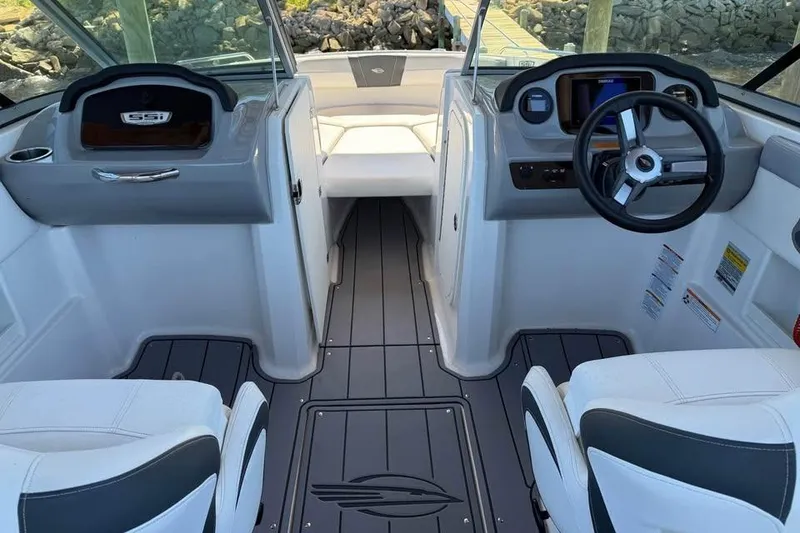 Slide: The Image of 2023 Chaparral 23 SSi OB boat interior with modern dashboard and seating. - 4