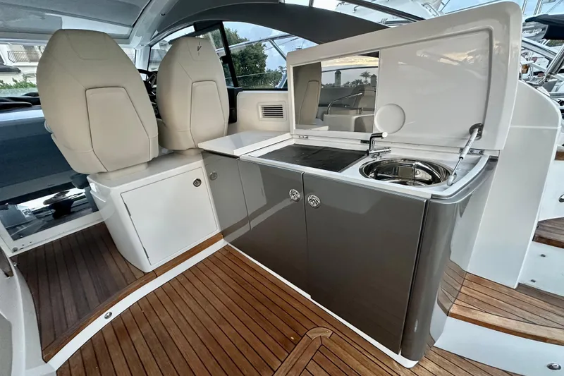 Slide: The Image of Luxurious 2021 Princess V40 yacht interior with elegant seating and scenic ocean view. - 10