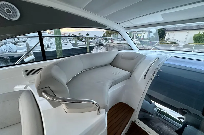 Slide: The Image of Interior of 2021 Princess V40 yacht with modern seating and wooden flooring. - 12