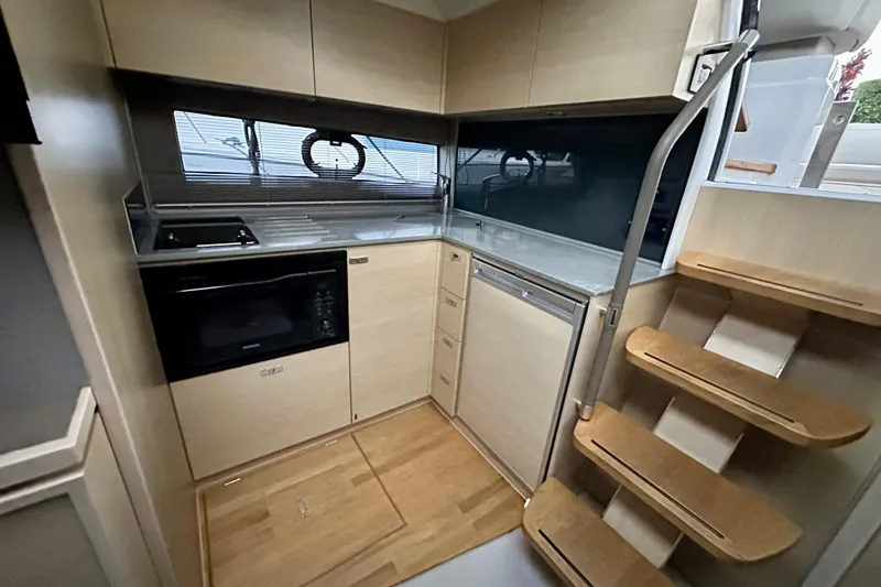 Slide: The Image of Interior of 2021 Princess V40 yacht with modern helm and seating area. - 16