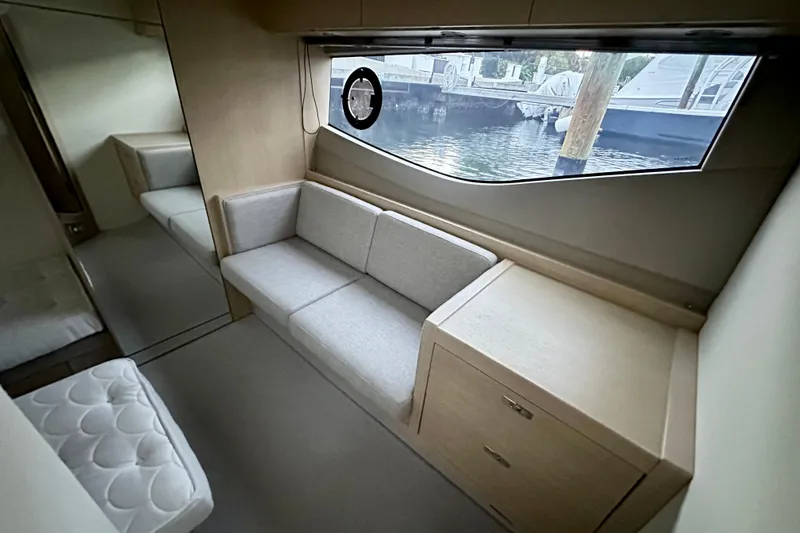 Slide: The Image of Luxurious 2021 Princess V40 yacht interior with plush seating and navigation display. - 18