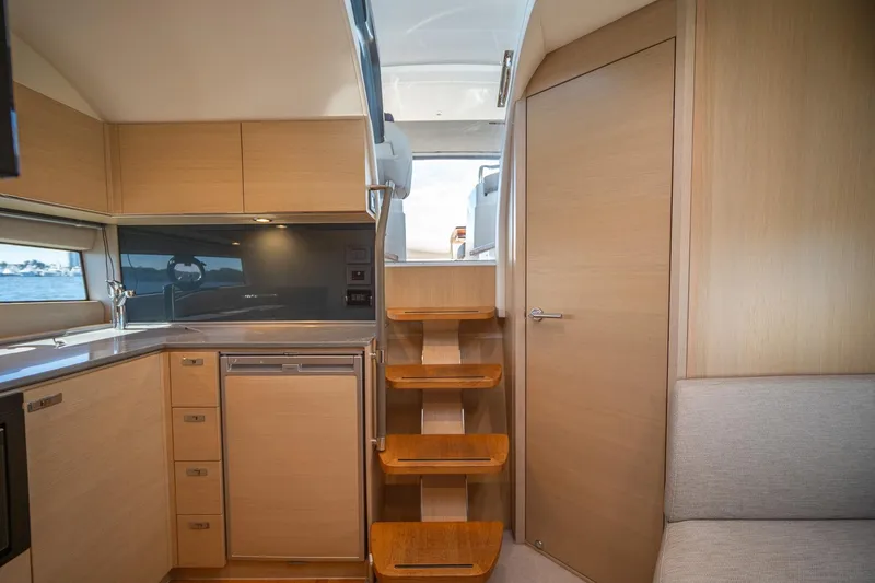 Slide: The Image of Modern interior of 2021 Princess V40 yacht with wooden cabinetry and stairs. - 26