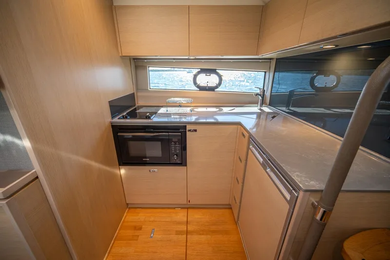 Slide: The Image of Modern kitchen interior on 2021 Princess V40 yacht with sleek cabinetry and appliances. - 28