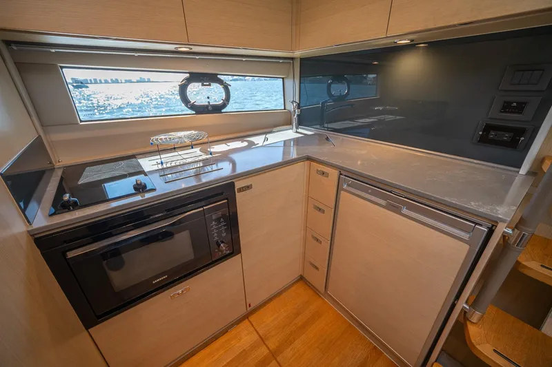 Slide: The Image of Modern kitchen interior of 2021 Princess V40 yacht with ocean view. - 29