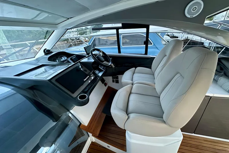Slide: The Image of Interior of 2021 Princess V40 yacht with modern navigation system and luxurious seating. - 3
