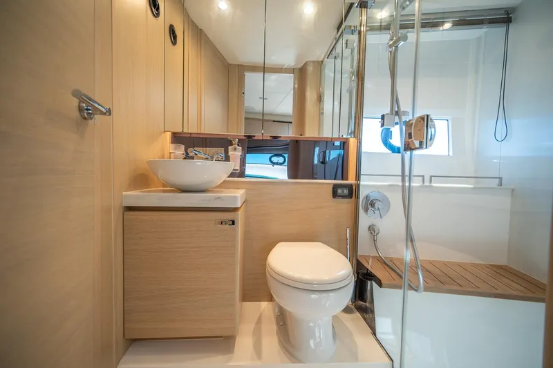 Slide: The Image of Luxurious bathroom in 2021 Princess V40 yacht with modern fixtures and wooden accents. - 31
