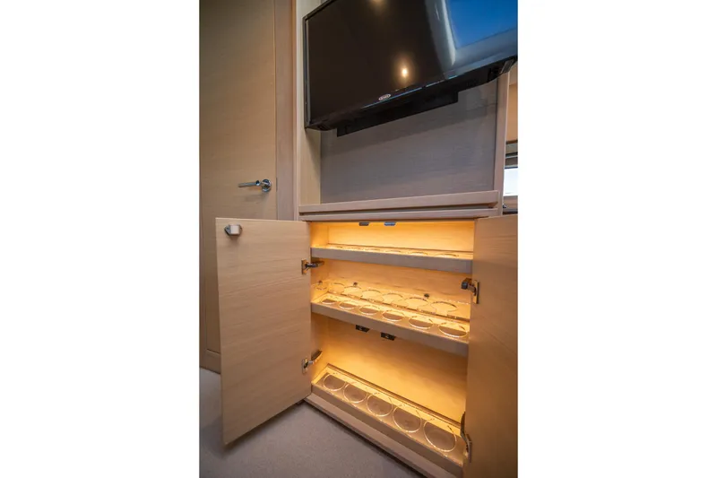 Slide: The Image of Illuminated cabinet with glass holders in 2021 Princess V40 yacht interior. - 33
