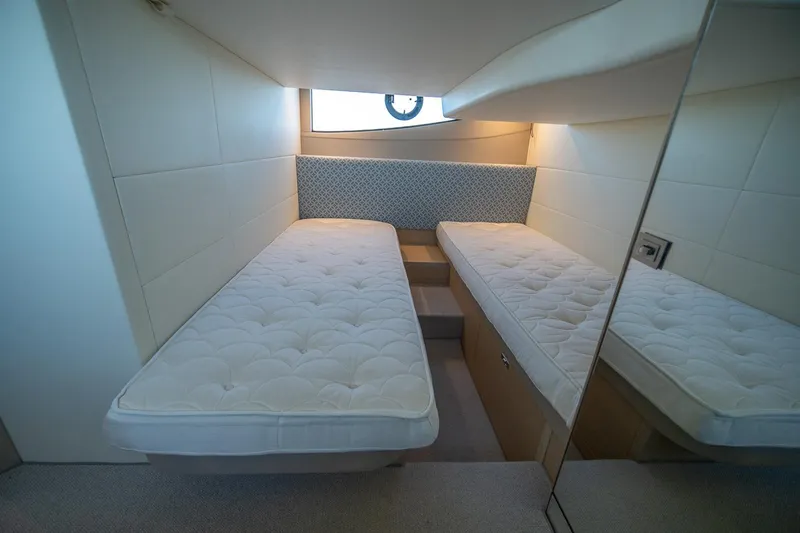 Slide: The Image of 2021 Princess V40 yacht interior with twin beds and modern design. - 37