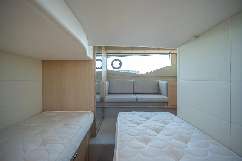 Slide: The Image of Interior of 2021 Princess V40 yacht with twin beds and a sofa. - 38