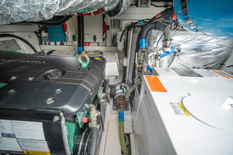 Slide: The Image of Engine room of 2021 Princess V40 yacht with visible machinery and wiring. - 43