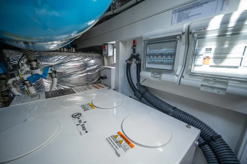 Slide: The Image of Engine room of 2021 Princess V40 yacht with control panels and wiring. - 46