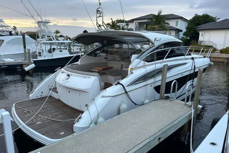 Slide: The Image of Luxurious interior of 2021 Princess V40 yacht with modern furnishings and large window view. - 5