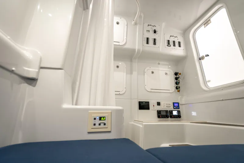 Slide: The Image of Interior of 2025 Yellowfin 42 Offshore boat, featuring control panels and seating. - 15