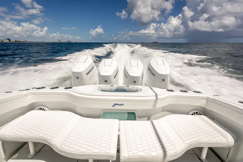 Slide: The Image of 2025 Yellowfin 42 Offshore boat cruising with powerful Mercury engines on open water. - 20