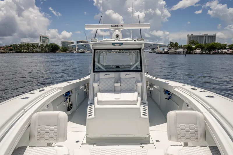 Slide: The Image of 2025 Yellowfin 42 Offshore boat on water, featuring sleek design and luxurious seating. - 23