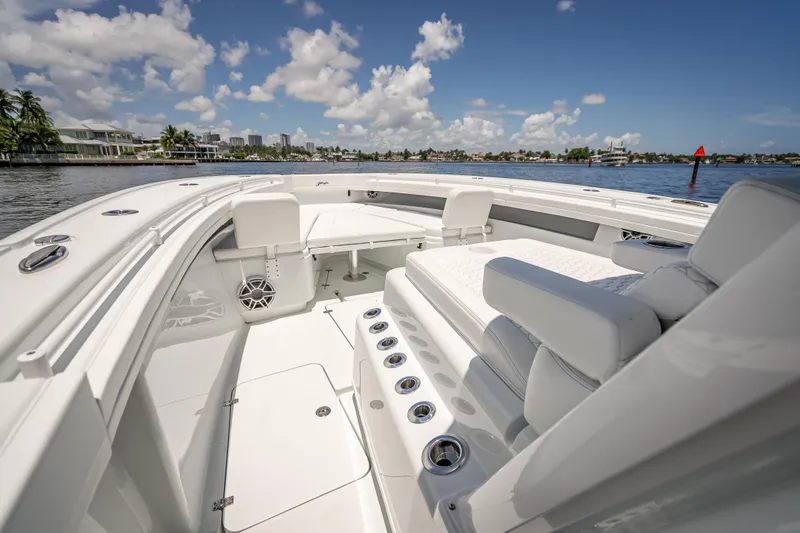 Slide: The Image of 2025 Yellowfin 42 Offshore boat interior with luxurious seating and ocean view. - 28