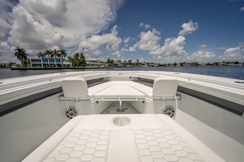 Slide: The Image of 2025 Yellowfin 42 Offshore boat interior with seating, on a sunny day by the water. - 29