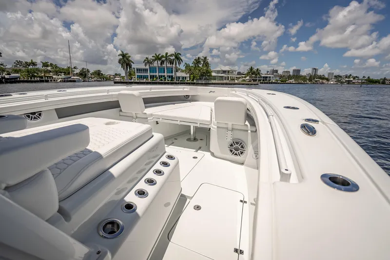 Slide: The Image of 2025 Yellowfin 42 Offshore boat interior with luxurious seating and ocean view. - 30
