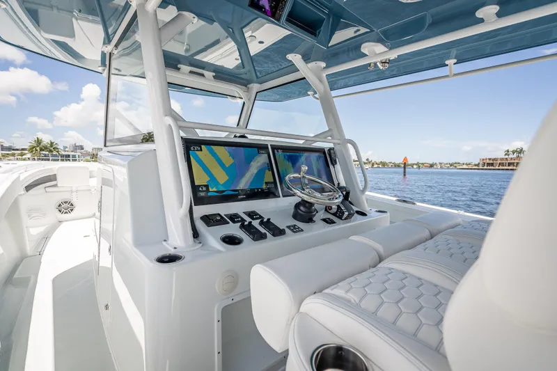 Slide: The Image of 2025 Yellowfin 42 Offshore boat cockpit with advanced navigation system and luxurious seating. - 40