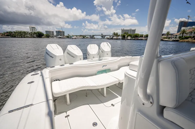 Slide: The Image of 2025 Yellowfin 42 Offshore boat with four Mercury engines on a sunny day. - 47